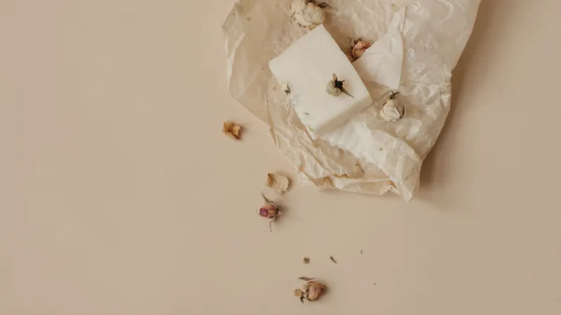 soy candle and matches on linen, flat lay