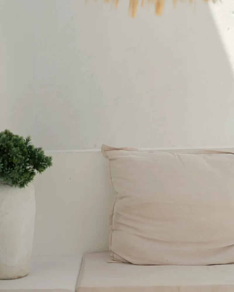 stacked cushion covers in warm shades