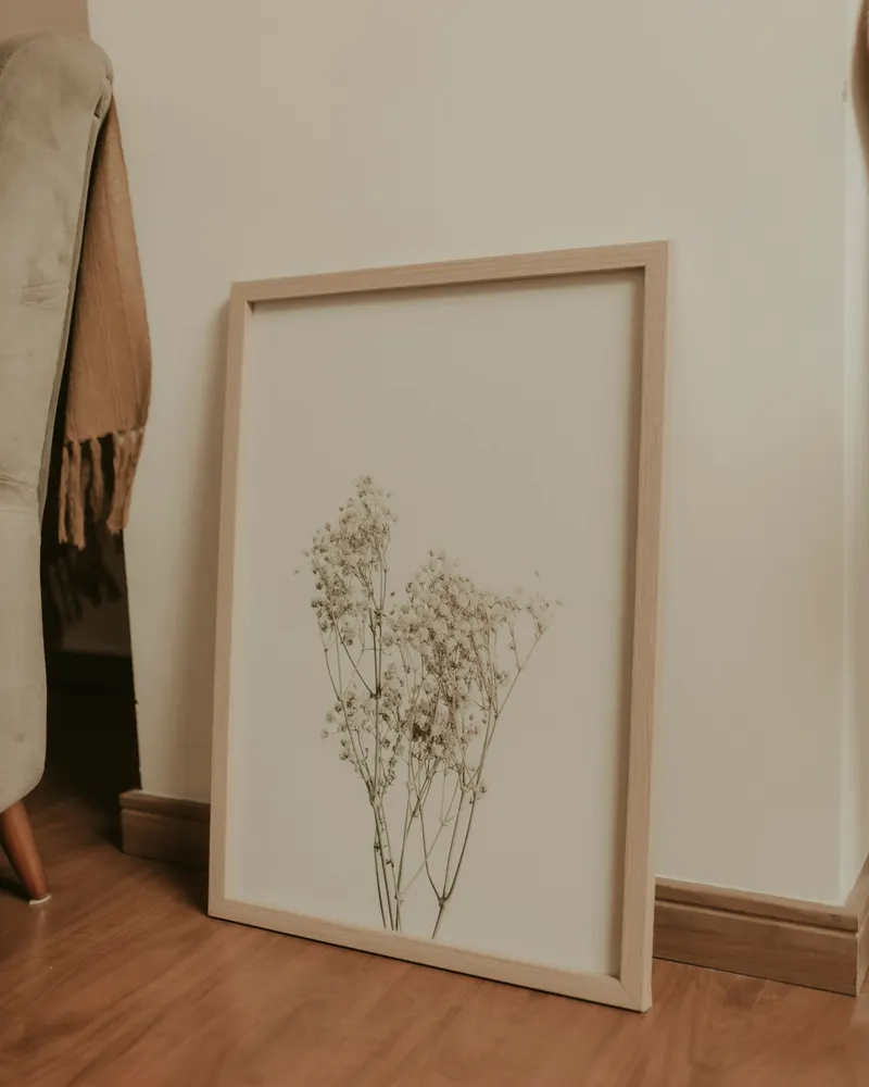 framed art leaning against a wall