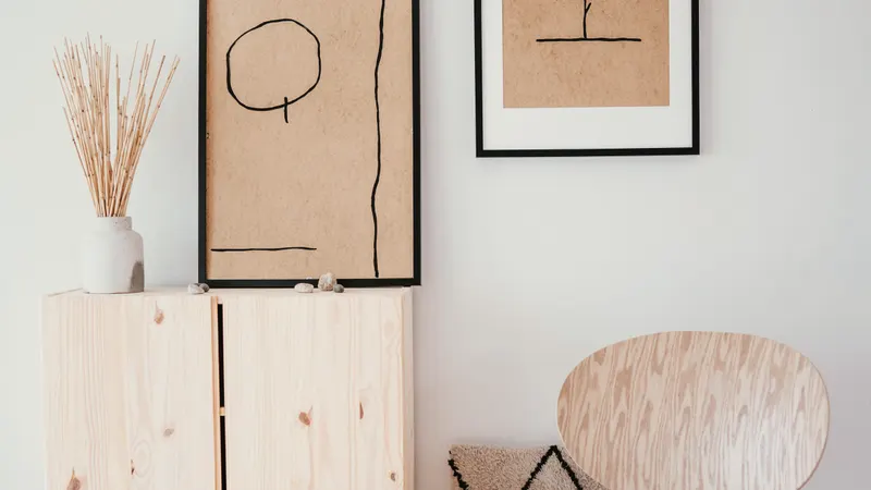 framed calligraphy on a plain plastered wall