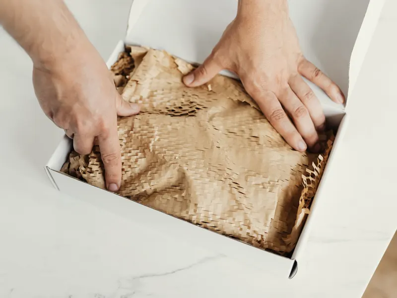 three pieces being placed in a box