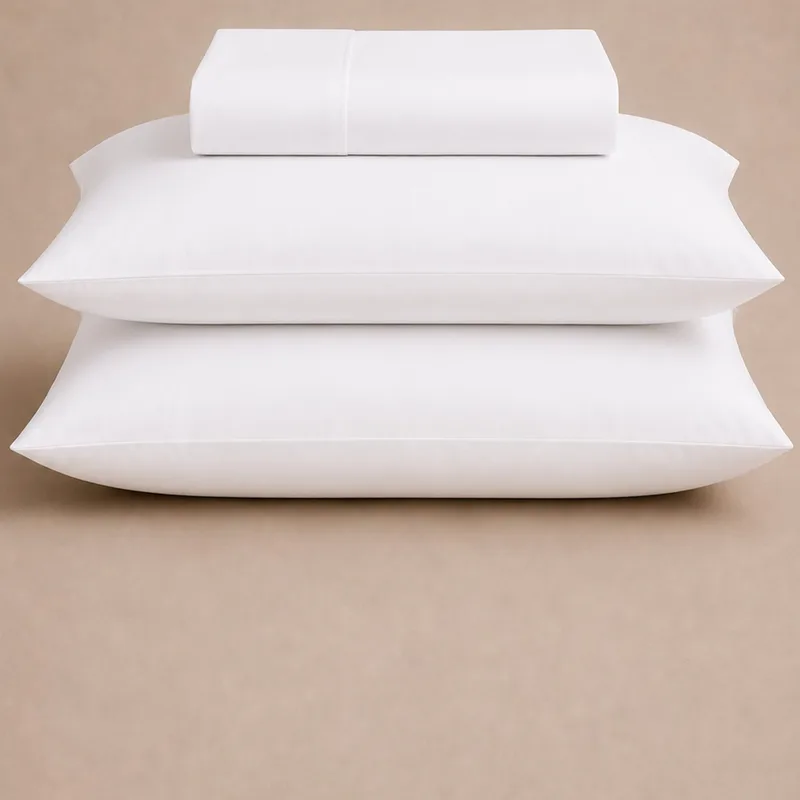 folded cotton bedsheet set on a plain ground