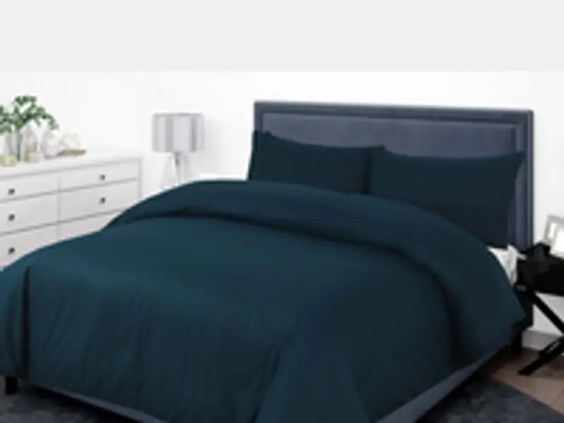 quilt on a bed in winter light