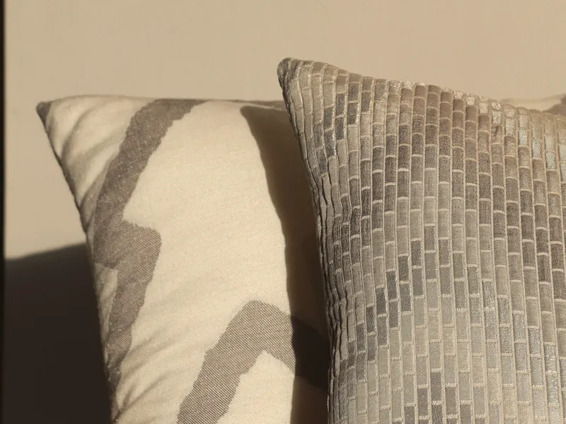 striped cushion on a linen sofa